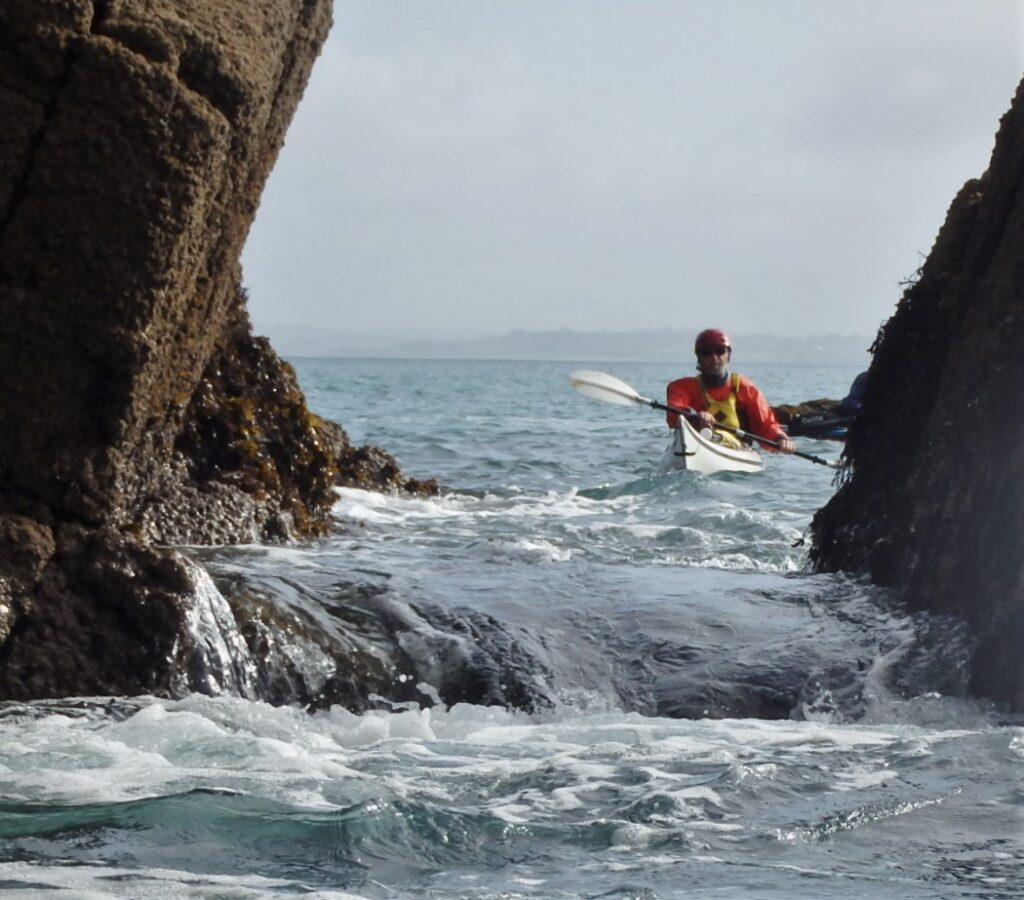 Running a pour-over during a coaching session in Brittany with British Sea Kayaks 
